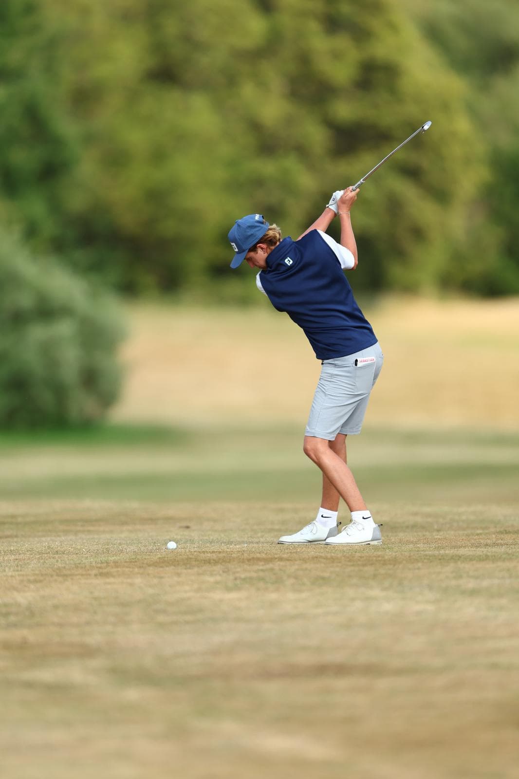 Seb Creaser at the top of the backswing